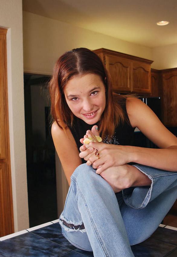 20P Sweet redhead teen sucking her feet