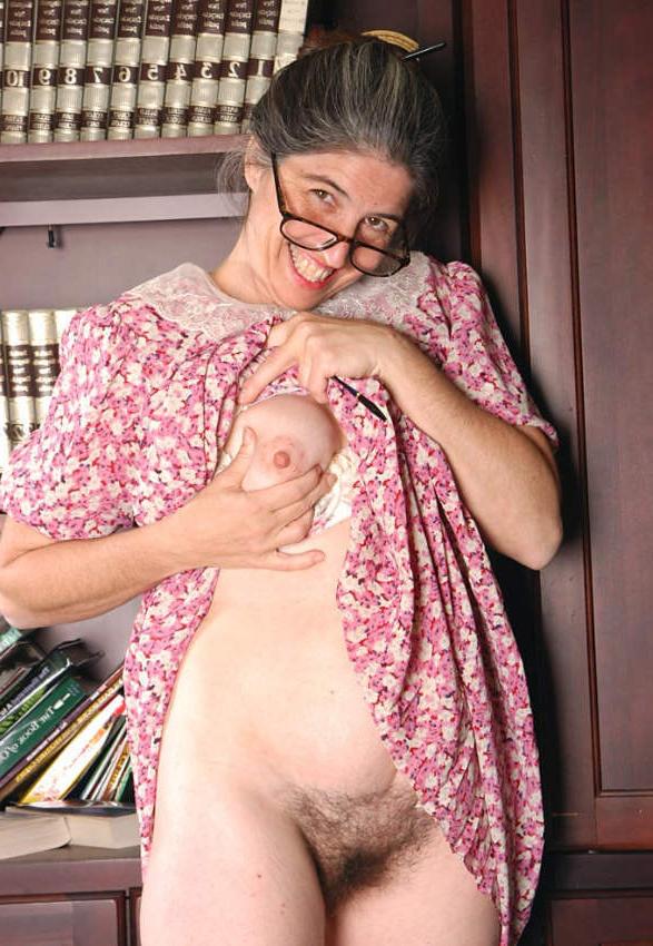20P Horny granny shows pussy in library