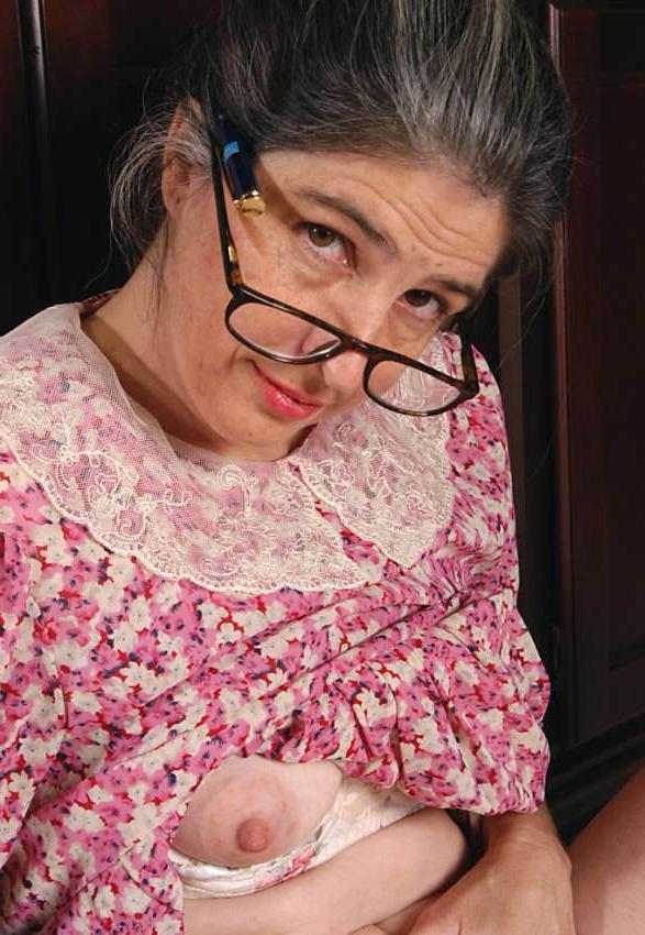 20P Horny granny shows pussy in library