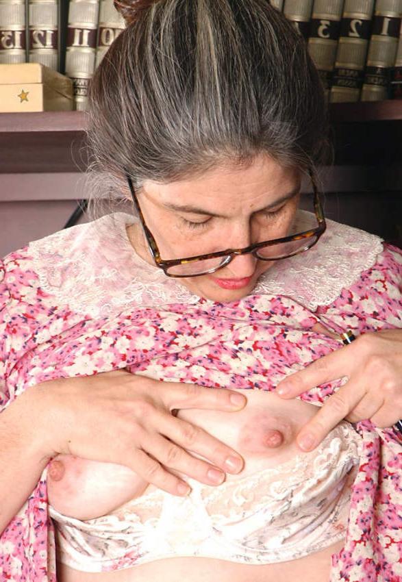 20P Horny granny shows pussy in library