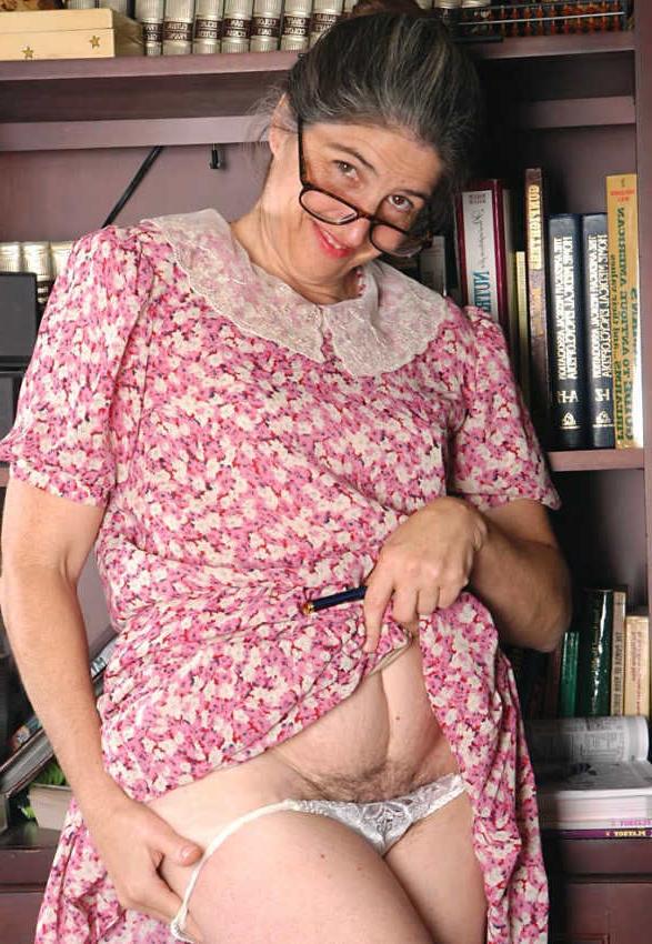 20P Horny granny shows pussy in library