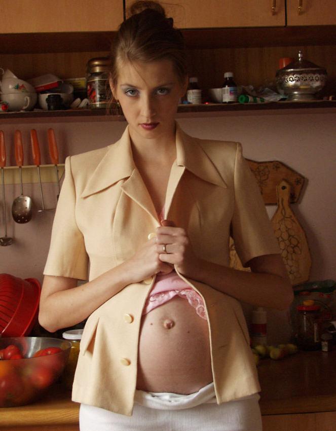 20P Busty preggo girl posing in kitchen
