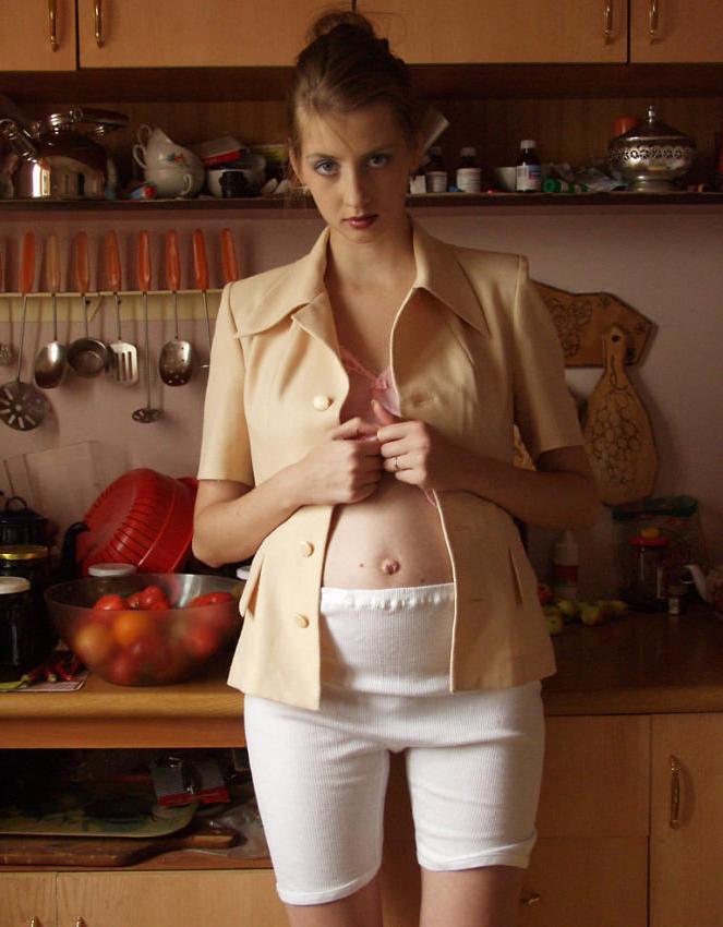 20P Busty preggo girl posing in kitchen