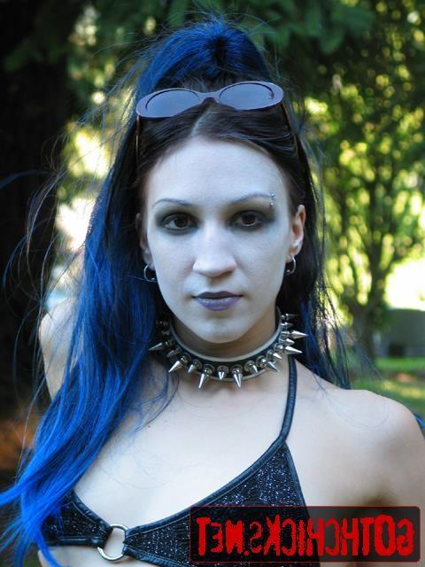 17P Goth poses on a cemetery