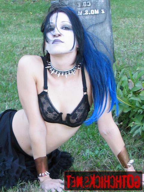17P Goth poses on a cemetery