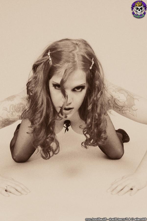 15P Classic Goth fetish Delilah shows off her corset