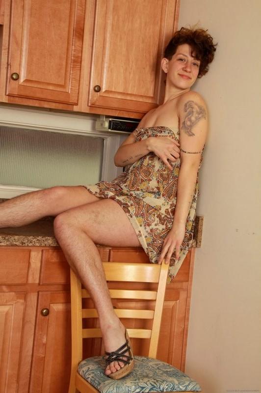 15P Simone strips in the kitchen and expopses a hairy one