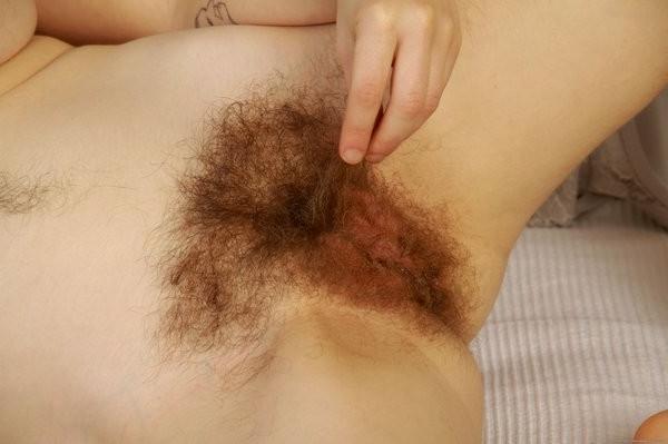 15P Big tit redhead Velma displays a hairy muffin