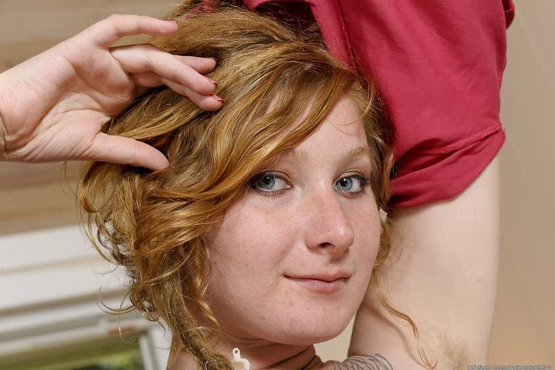 16P Hairy redhead bares pointy tits and fullbush pussy