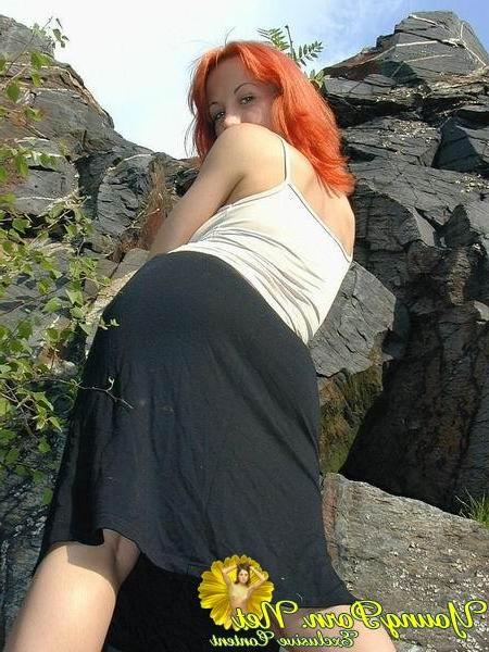 15P Gorgeous redhead cutie posing in nature