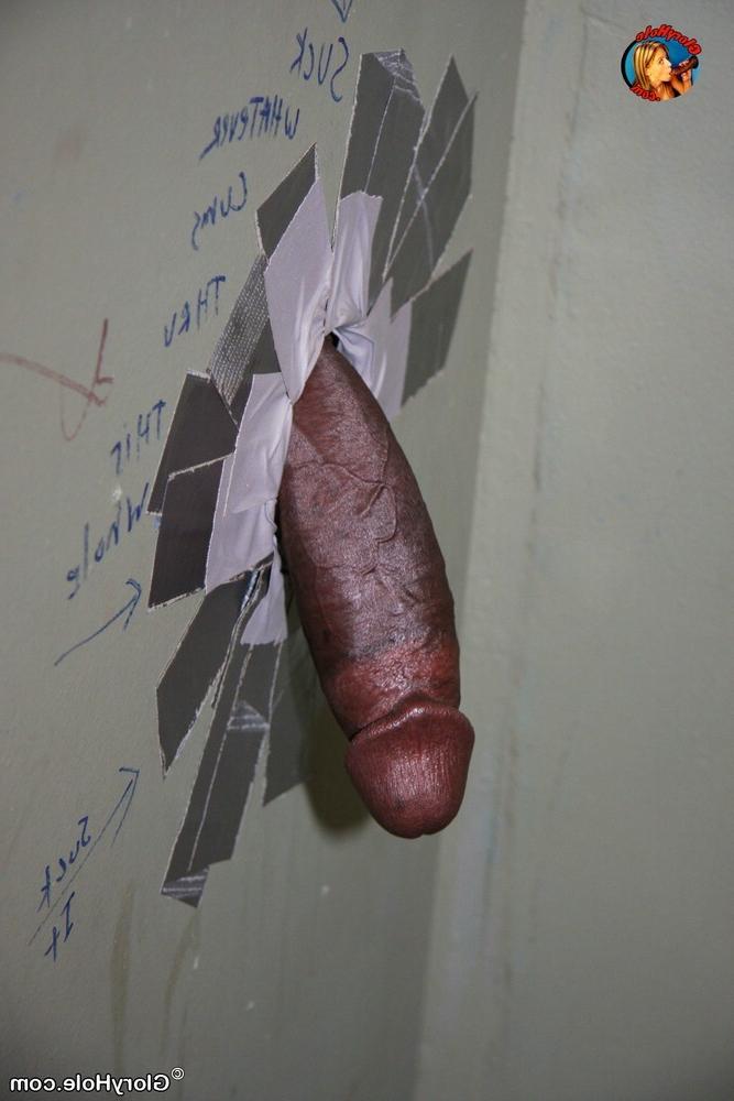 15P Pretty babe sucks a big black cock through a gloryhole