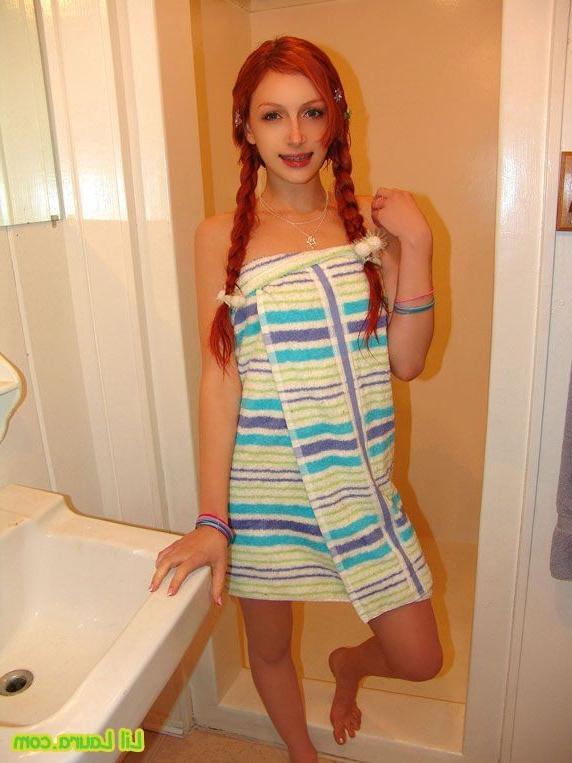 16P Pretty redhead teen washing and teasing her pussy under shower