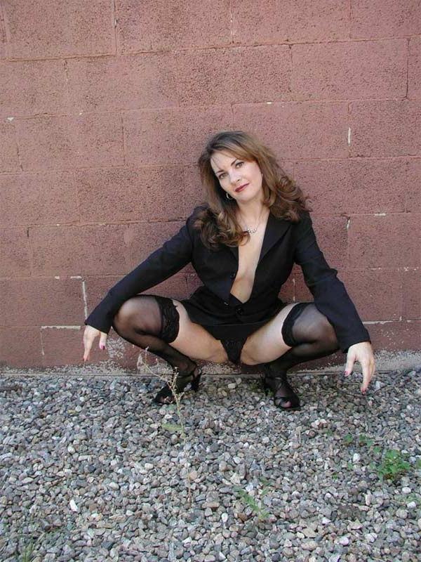 20P Horny brunette milf loves flashing her tit in sexy uniform
