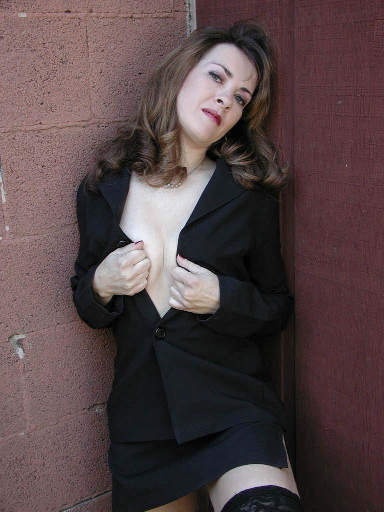 20P Horny brunette milf loves flashing her tit in sexy uniform
