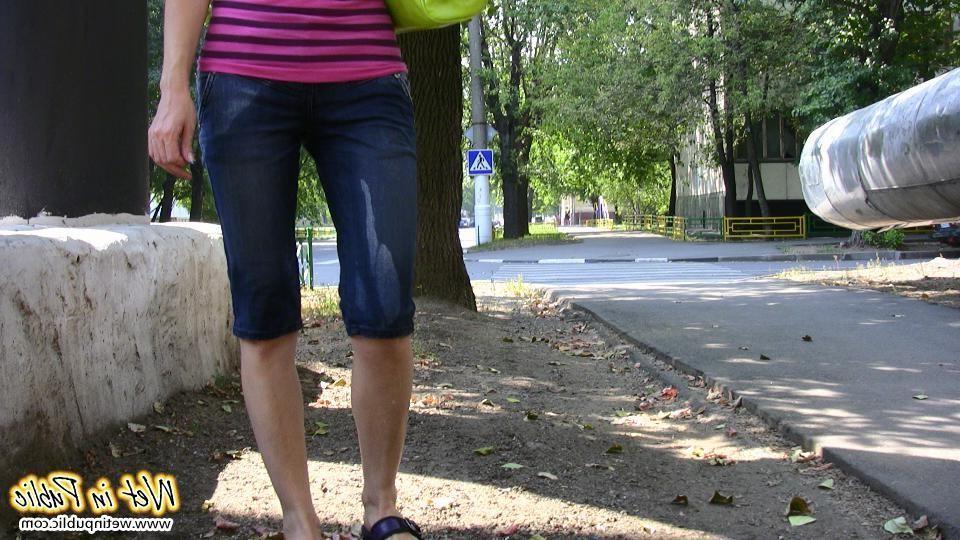 12P Hot chick has to change on the street after wetting her jeans breeches