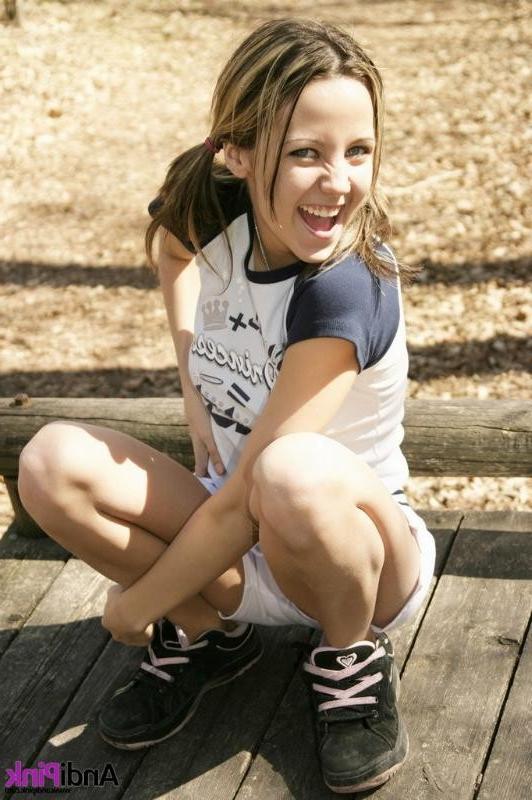 15P Young Andi Pink shows her shaved pink pussy in public