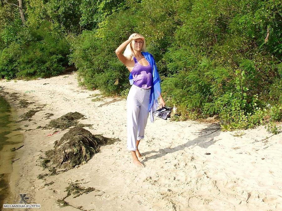 9P Gorgeous blonde Russian nudist sunbathes naked