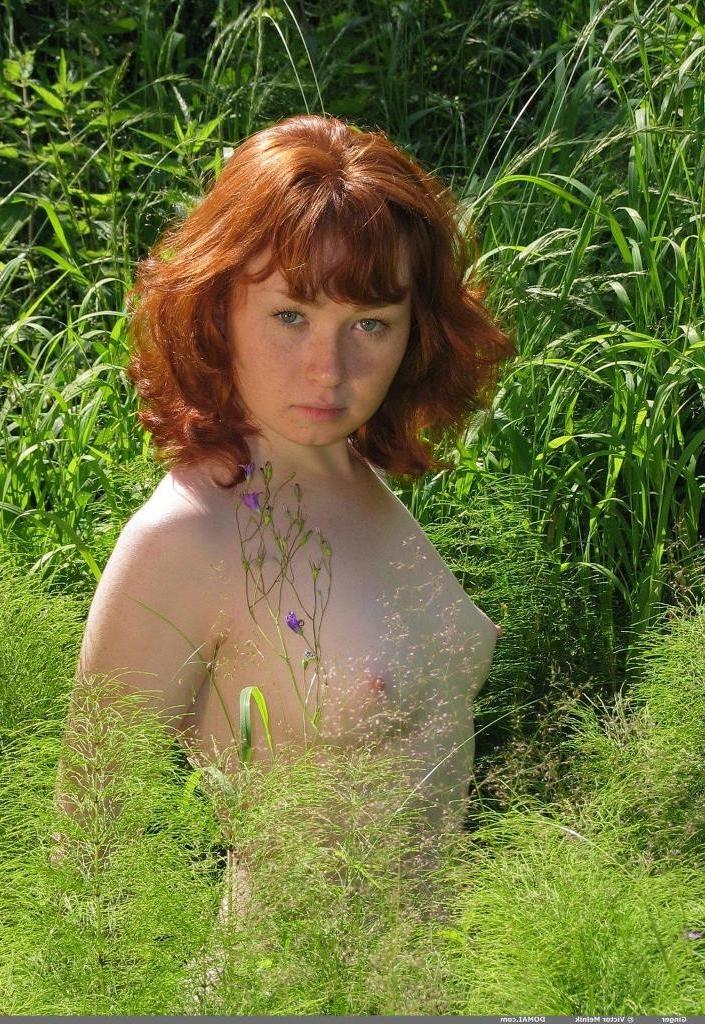 16P Pretty redhead posing nude outside by stream