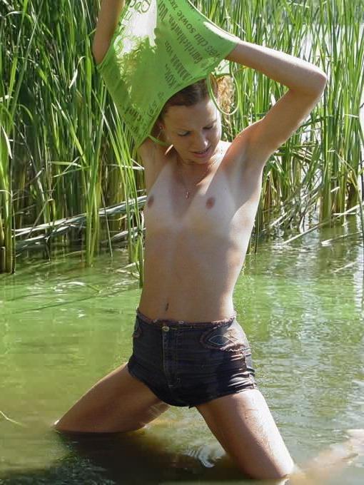 16P Skinny Redhead Roza Strips Naked Outdoors in Lake