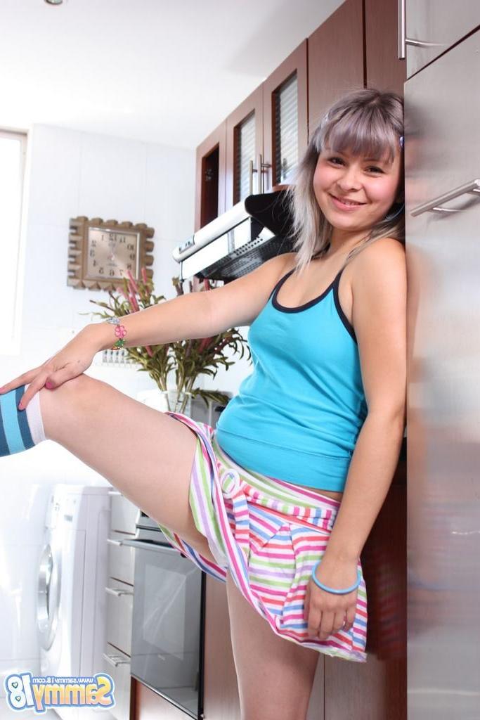 15P Small titted teen shows pussy and ass in kitchen
