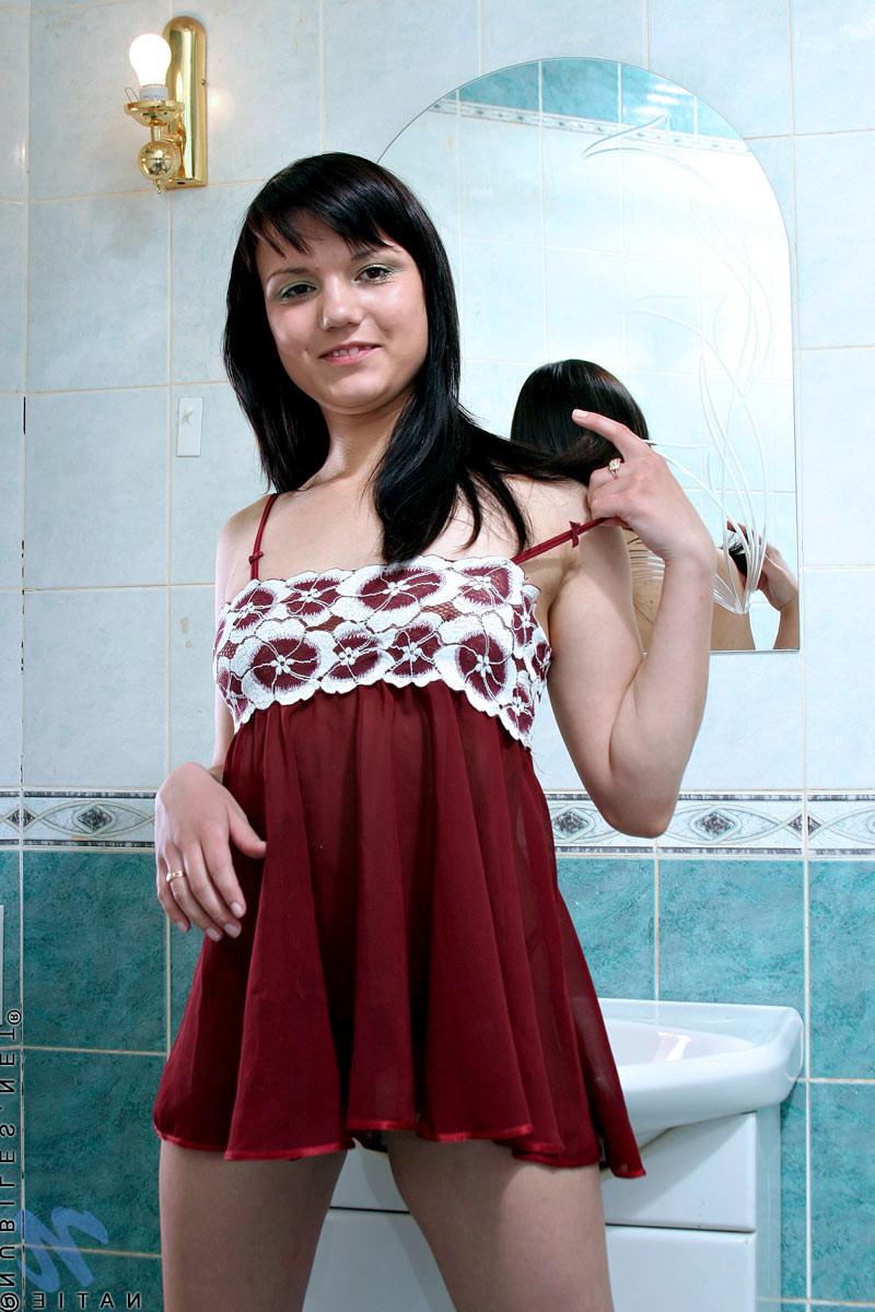10P Natie plays with her perky teen tits in the kitchen