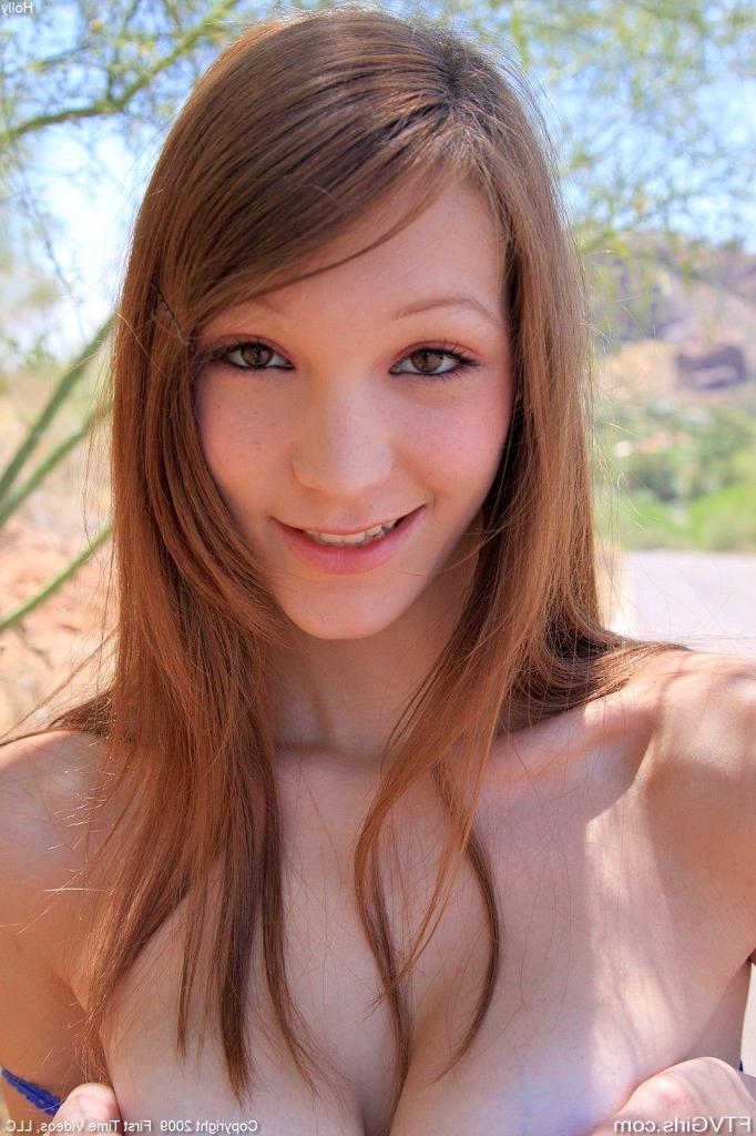 16P Cute redhead teen rubbing her tits and fingering pussy in public