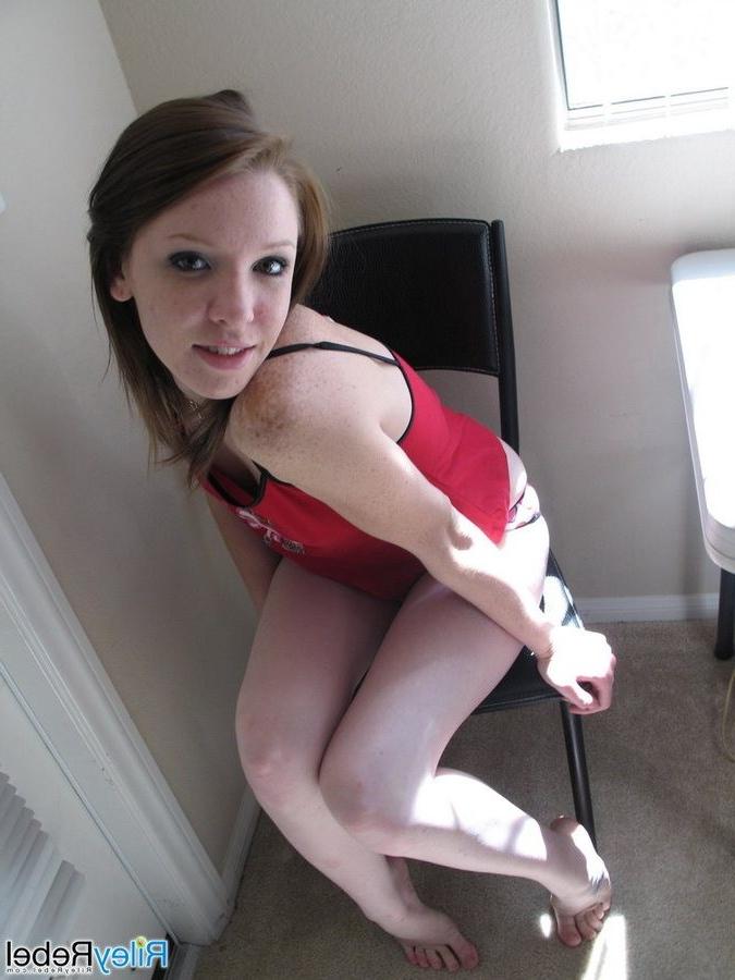 16P Hot and naugty redhead teen Riley Rebel strips