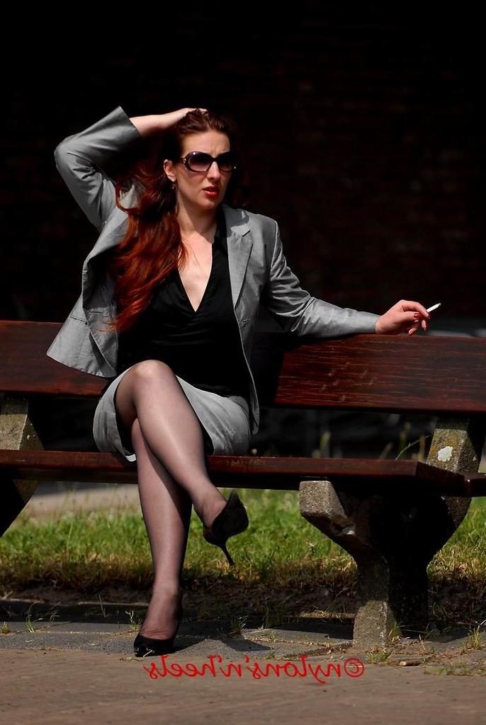 12P Redhead Lady Justine in nylons smoking outdoors