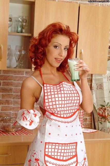 16P Sexy redhead Ashley Robbins playing with milk in the kitchen