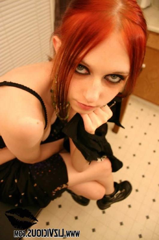 14P Redhead goth chick strips and poses