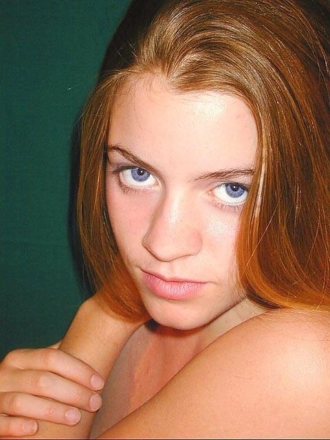 18P Fiery redhead teen stripping and posing