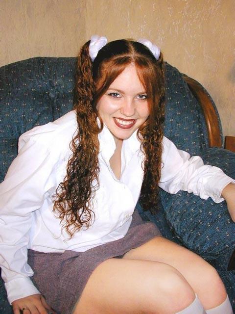 18P Pigtailed redhead teen spreads