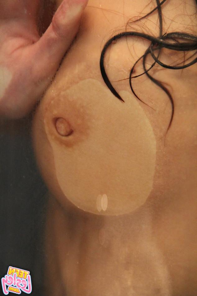 15P Skinny eighteen year old presses boobs against glass shower door