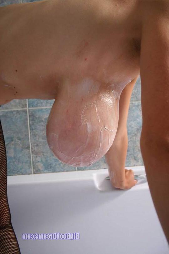 16P busty babe posing in stockings in the shower