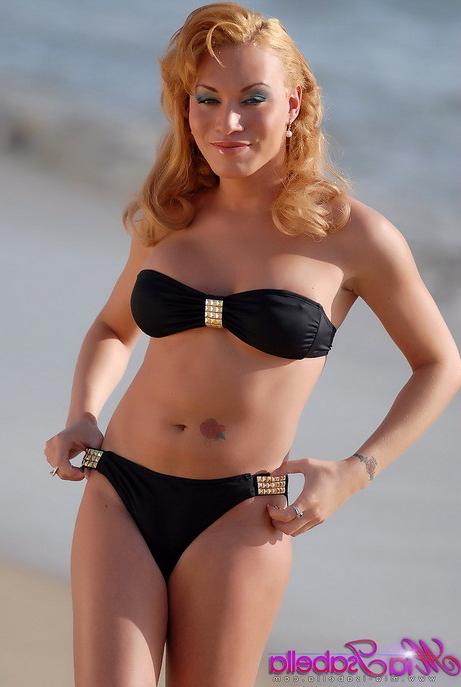15P Bikini clad Mia Isabella flashes some boobage at the beach