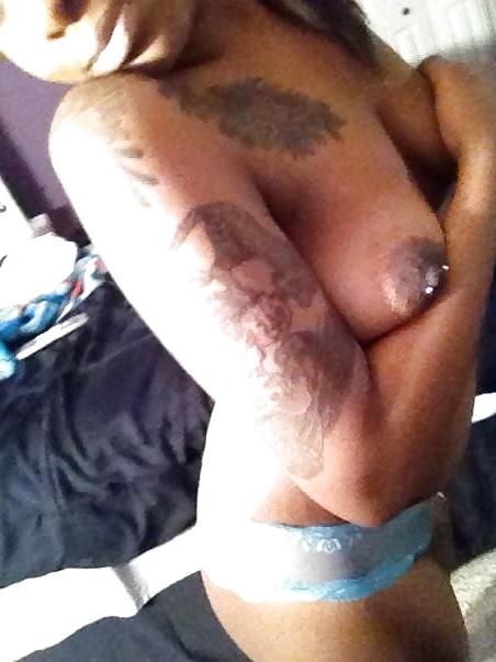 9P Tatoo Peirced Hondurian Black Girl