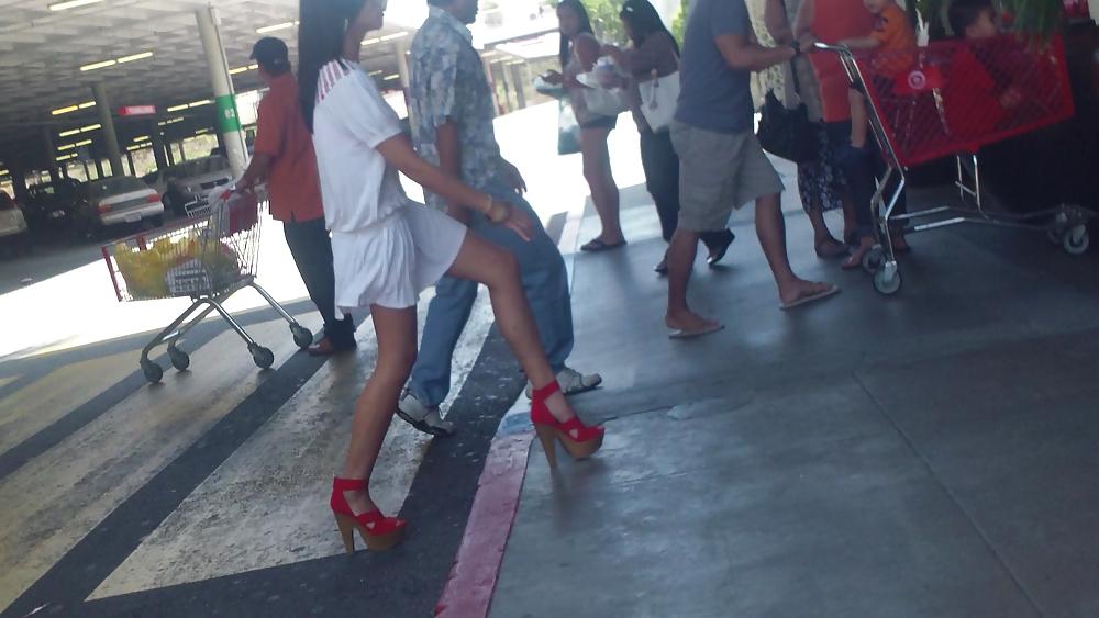 25P Cute girls ass & butt in short white mini skirt & red shoes