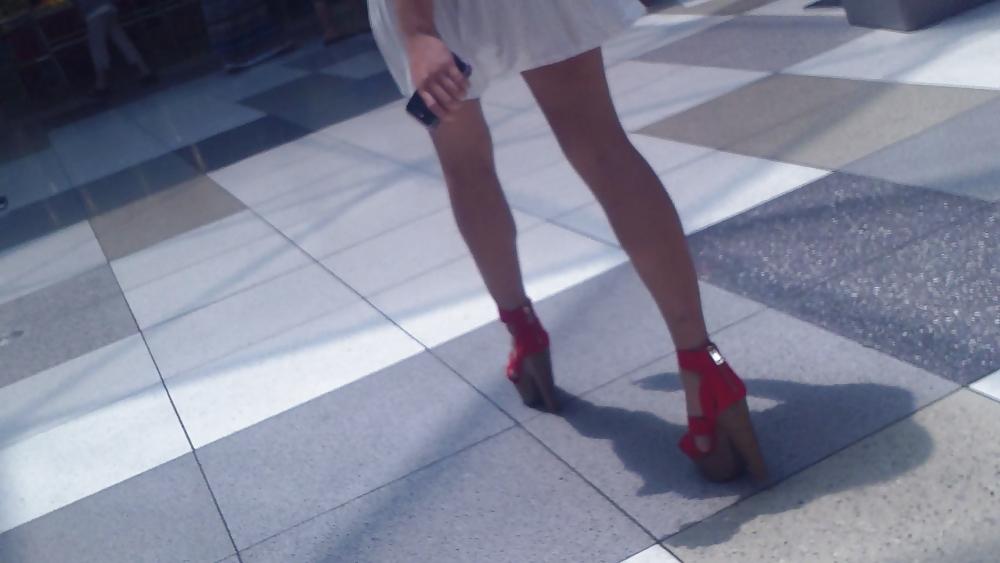 25P Cute girls ass & butt in short white mini skirt & red shoes