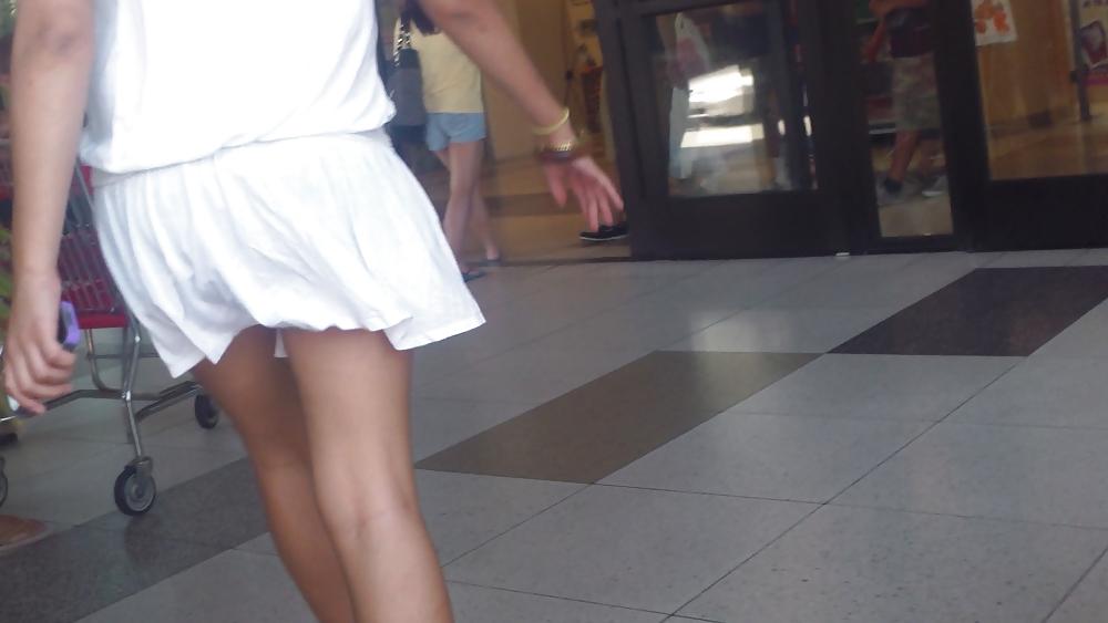 25P Cute girls ass & butt in short white mini skirt & red shoes