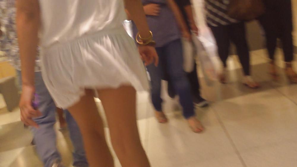 25P Cute girls ass & butt in short white mini skirt & red shoes