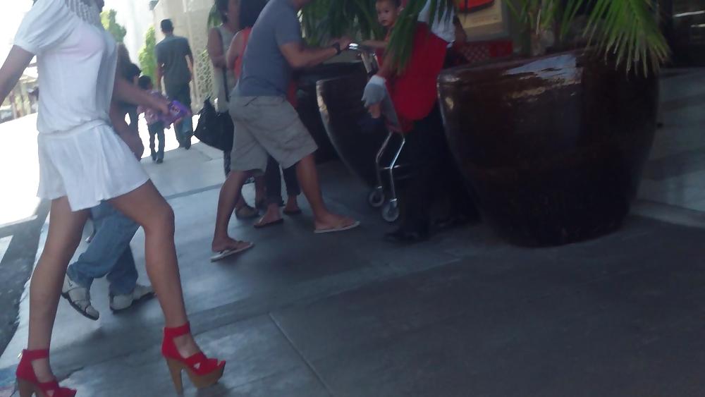 25P Cute girls ass & butt in short white mini skirt & red shoes