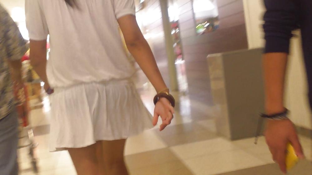 25P Cute girls ass & butt in short white mini skirt & red shoes