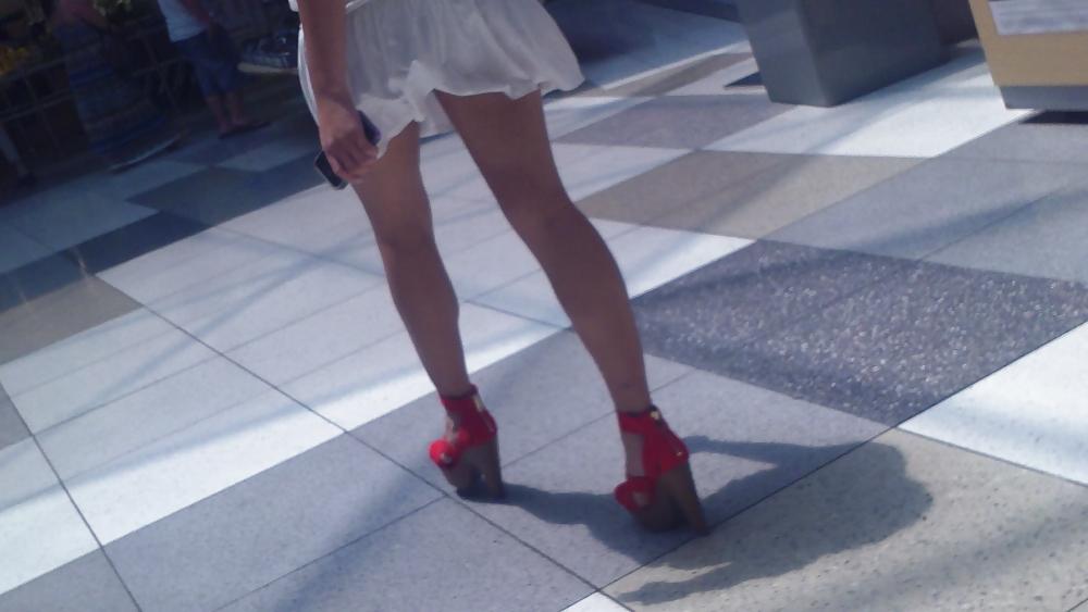25P Cute girls ass & butt in short white mini skirt & red shoes
