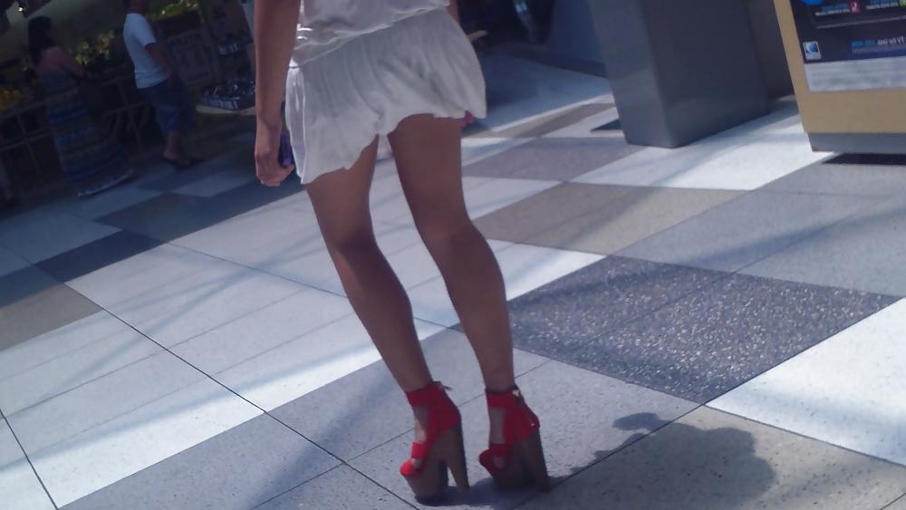 25P Cute girls ass & butt in short white mini skirt & red shoes