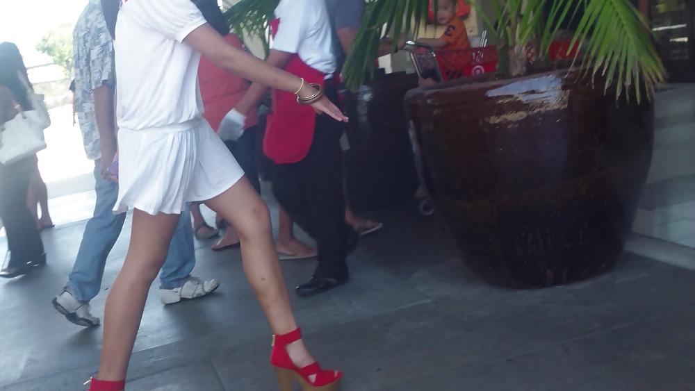 25P Cute girls ass & butt in short white mini skirt & red shoes