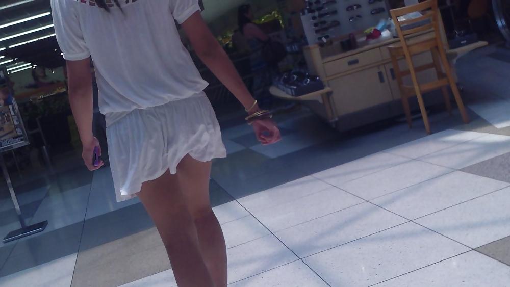 25P Cute girls ass & butt in short white mini skirt & red shoes