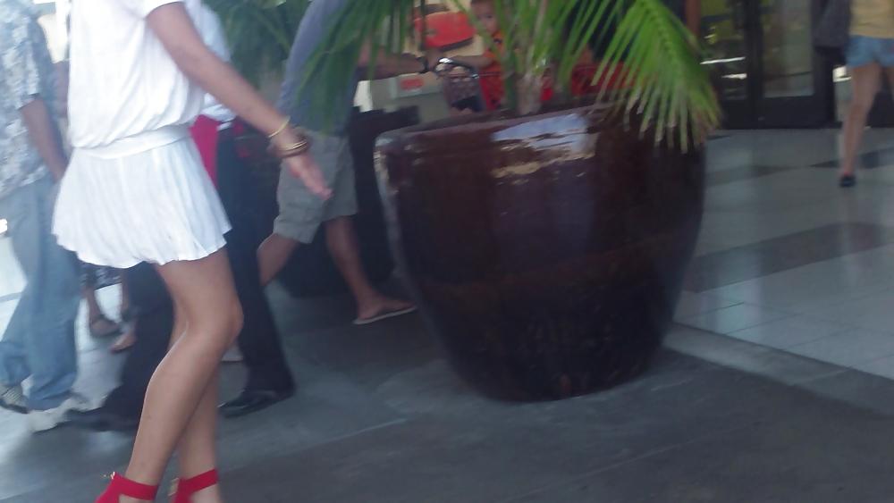 25P Cute girls ass & butt in short white mini skirt & red shoes