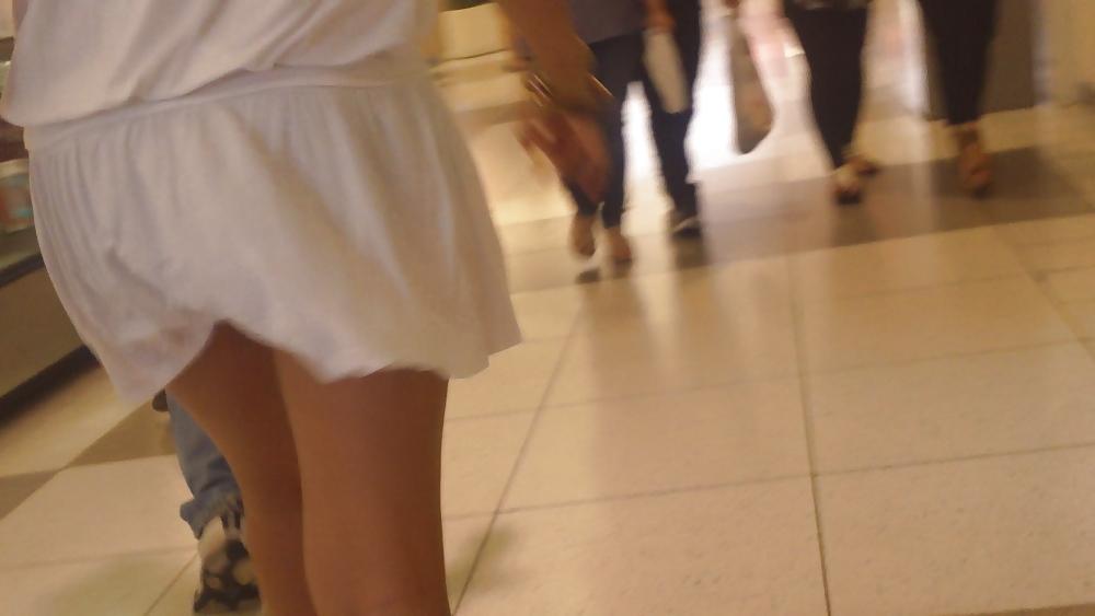 25P Cute girls ass & butt in short white mini skirt & red shoes