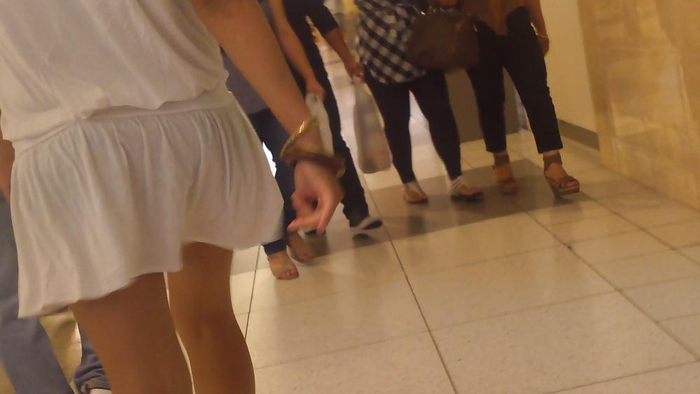 25P Cute girls ass & butt in short white mini skirt & red shoes