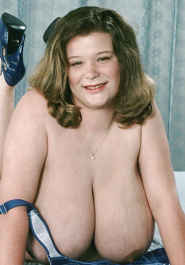 25P Busty dark-blonde BBW posing her ample assets